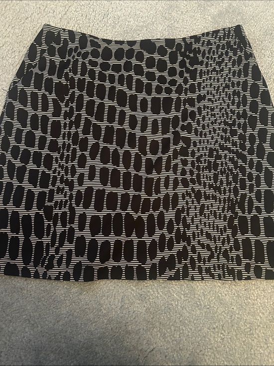 Tail Dresses & Skirts - Tail print black & tan skort